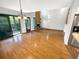 This is a bright living room with hardwood floors, a fireplace, high ceilings, and a patio access to the backyard at 2011 Arbor Dr, Clearwater, FL 33760
