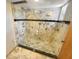 Spacious shower with marble and glass enclosure, complete with multiple shower heads and updated fixtures at 2011 Arbor Dr, Clearwater, FL 33760