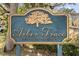 Arbor Trace community sign with a logo of tree, indicating a private road at 2011 Arbor Dr, Clearwater, FL 33760