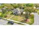 A corner lot home is surrounded by lush greenery and features a paved walkway and manicured landscaping at 22119 Weeks Blvd, Land O Lakes, FL 34639