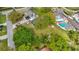 Aerial view of the house showcasing the pool and solar panels at 22119 Weeks Blvd, Land O Lakes, FL 34639