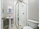 Bathroom features a stand up shower with glass doors, toilet and sink at 22119 Weeks Blvd, Land O Lakes, FL 34639