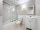 Bathroom features shower/tub combination, toilet and sink with cabinet at 22119 Weeks Blvd, Land O Lakes, FL 34639