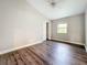 View of bedroom showcasing new flooring, ceiling fan, window and closet at 22119 Weeks Blvd, Land O Lakes, FL 34639