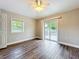 Bedroom with sliding glass doors to the outdoor patio at 22119 Weeks Blvd, Land O Lakes, FL 34639