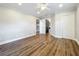 Spacious bedroom featuring beautiful wood floors, ceiling fan, and three doors at 22119 Weeks Blvd, Land O Lakes, FL 34639