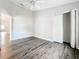 Bedroom showing new flooring, a ceiling fan and closet with double doors at 22119 Weeks Blvd, Land O Lakes, FL 34639