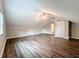 Spacious bonus room with wood floors, a ceiling fan and two storage closets at 22119 Weeks Blvd, Land O Lakes, FL 34639