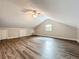 Spacious bonus room with wood floors, a ceiling fan, a window and two storage closets at 22119 Weeks Blvd, Land O Lakes, FL 34639