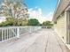 Expansive deck with white railings and a green exterior at 22119 Weeks Blvd, Land O Lakes, FL 34639