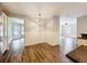 Well-lit dining area showcasing stylish flooring and providing an open view to adjacent rooms at 22119 Weeks Blvd, Land O Lakes, FL 34639