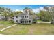 Lovely two-story home with unique architectural details and a well-manicured front lawn at 22119 Weeks Blvd, Land O Lakes, FL 34639