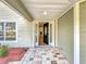 Inviting entryway with stone tile and a decorative front door welcomes you into this lovely home at 22119 Weeks Blvd, Land O Lakes, FL 34639