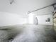 Clean garage space, featuring ample storage and a white interior at 22119 Weeks Blvd, Land O Lakes, FL 34639