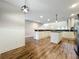 Open-concept kitchen featuring a center island, granite countertops, and ample cabinetry, ideal for entertaining at 22119 Weeks Blvd, Land O Lakes, FL 34639