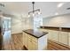 Stylish kitchen with a granite-topped island, modern lighting, and an open layout at 22119 Weeks Blvd, Land O Lakes, FL 34639