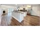 Spacious kitchen with a center island, stainless steel appliances, and a breakfast bar overlooking the living area at 22119 Weeks Blvd, Land O Lakes, FL 34639