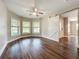 Stylish living room featuring wood floors, lots of natural light, and a trendy sliding barn door at 22119 Weeks Blvd, Land O Lakes, FL 34639
