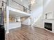 Inviting living room showcasing soaring ceilings, a cozy fireplace, and an open layout with abundant natural light at 22119 Weeks Blvd, Land O Lakes, FL 34639