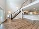 Open-concept living space with a balcony view, flowing seamlessly into the kitchen area at 22119 Weeks Blvd, Land O Lakes, FL 34639