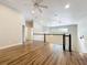 Bright loft area with staircase, ceiling fan, and wood-look floors at 22119 Weeks Blvd, Land O Lakes, FL 34639