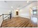 Upper level area featuring wood look flooring and a unique nook at 22119 Weeks Blvd, Land O Lakes, FL 34639