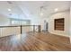 Upper level loft area with wood look flooring at 22119 Weeks Blvd, Land O Lakes, FL 34639