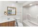 Well-lit bathroom with a shower, vanity, and mirror at 230 Davison Ne Ave, St Petersburg, FL 33703