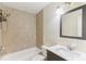 Bathroom featuring tiled shower, toilet, and vanity with a mirror and lighting at 230 Davison Ne Ave, St Petersburg, FL 33703