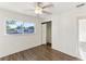 Bedroom featuring hard surface flooring, closet, and natural light at 230 Davison Ne Ave, St Petersburg, FL 33703