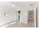 Bright bedroom features ceiling fan, closet and neutral walls at 230 Davison Ne Ave, St Petersburg, FL 33703