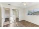 Inviting bedroom with hard surface floors, closet, and attached bathroom at 230 Davison Ne Ave, St Petersburg, FL 33703