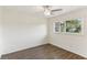 Cozy bedroom with a large window offering views of lush greenery at 230 Davison Ne Ave, St Petersburg, FL 33703