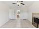 Spacious bedroom with tile floors and a fireplace, leading to an en-suite bathroom at 230 Davison Ne Ave, St Petersburg, FL 33703