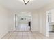 Dining area with tile floors connecting to the kitchen and other living spaces at 230 Davison Ne Ave, St Petersburg, FL 33703