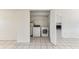 Well-lit laundry room area featuring modern washer and dryer units inside the house at 230 Davison Ne Ave, St Petersburg, FL 33703