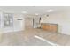 Open-concept living area with lots of natural light and kitchen counter at 230 Davison Ne Ave, St Petersburg, FL 33703