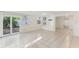 Open-concept living area with lots of natural light and access to the outside patio at 230 Davison Ne Ave, St Petersburg, FL 33703