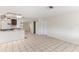 Open living area with tile floors, skylight and smooth transition into other rooms at 230 Davison Ne Ave, St Petersburg, FL 33703