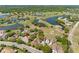 Beautiful aerial view of residential homes with luscious green landscaping and walking trails at 2618 Newcomb Ct # 12, Sun City Center, FL 33573