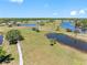 Scenic aerial view of luscious green lawns, beautiful water views and paved walking trails at 2618 Newcomb Ct # 12, Sun City Center, FL 33573