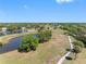 Scenic aerial view of luscious green lawns, beautiful water views and paved walking trails at 2618 Newcomb Ct # 12, Sun City Center, FL 33573