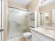 Bathroom featuring a shower, toilet, vanity, and storage shelves at 2618 Newcomb Ct # 12, Sun City Center, FL 33573