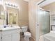 Bathroom featuring a shower, toilet, and vanity at 2618 Newcomb Ct # 12, Sun City Center, FL 33573