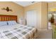 Bedroom featuring a closet and wooden furniture at 2618 Newcomb Ct # 12, Sun City Center, FL 33573