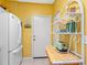 The kitchen features white appliances, with convenient layout and door to the exterior at 2618 Newcomb Ct # 12, Sun City Center, FL 33573