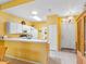 Well-lit kitchen boasting ample counter space, white appliances, and a convenient layout for cooking and dining at 2618 Newcomb Ct # 12, Sun City Center, FL 33573