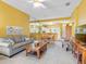 Open-concept living space features tile flooring and seamless flow between the living, dining, and kitchen areas at 2618 Newcomb Ct # 12, Sun City Center, FL 33573