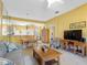 Relaxing space with tile flooring and seamless flow between the living, dining, and kitchen areas at 2618 Newcomb Ct # 12, Sun City Center, FL 33573