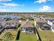Aerial view of a single Gathering home featuring a screened-in lanai and a spacious backyard at 2934 Living Coral Dr, Odessa, FL 33556